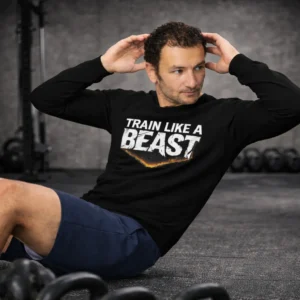Front view of the unisex Lift Heavy Walk Funny gym sweatshirt in black, featuring bold white and orange typography. Train Like a Beast Sweatshirt | Motivational Gym Sweatshirt for Fitness Lovers