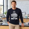 I Teach Science Half-Life Long Sleeve I Teach Science. My Patience Has a Half-Life long sleeve shirt beside a laboratory bench.
