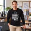 Professionally Patient Privately Tired Long Sleeve Teacher Shirt Professionally Patient Privately Tired unisex long sleeve shirt with a coffee cup graphic in a teachers’ staff lounge