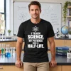 I Teach Science My Patience Has a Half-Life Teacher Shirt Lifestyle Mockup Male science teacher wearing I Teach Science My Patience Has a Half-Life T-shirt in classroom